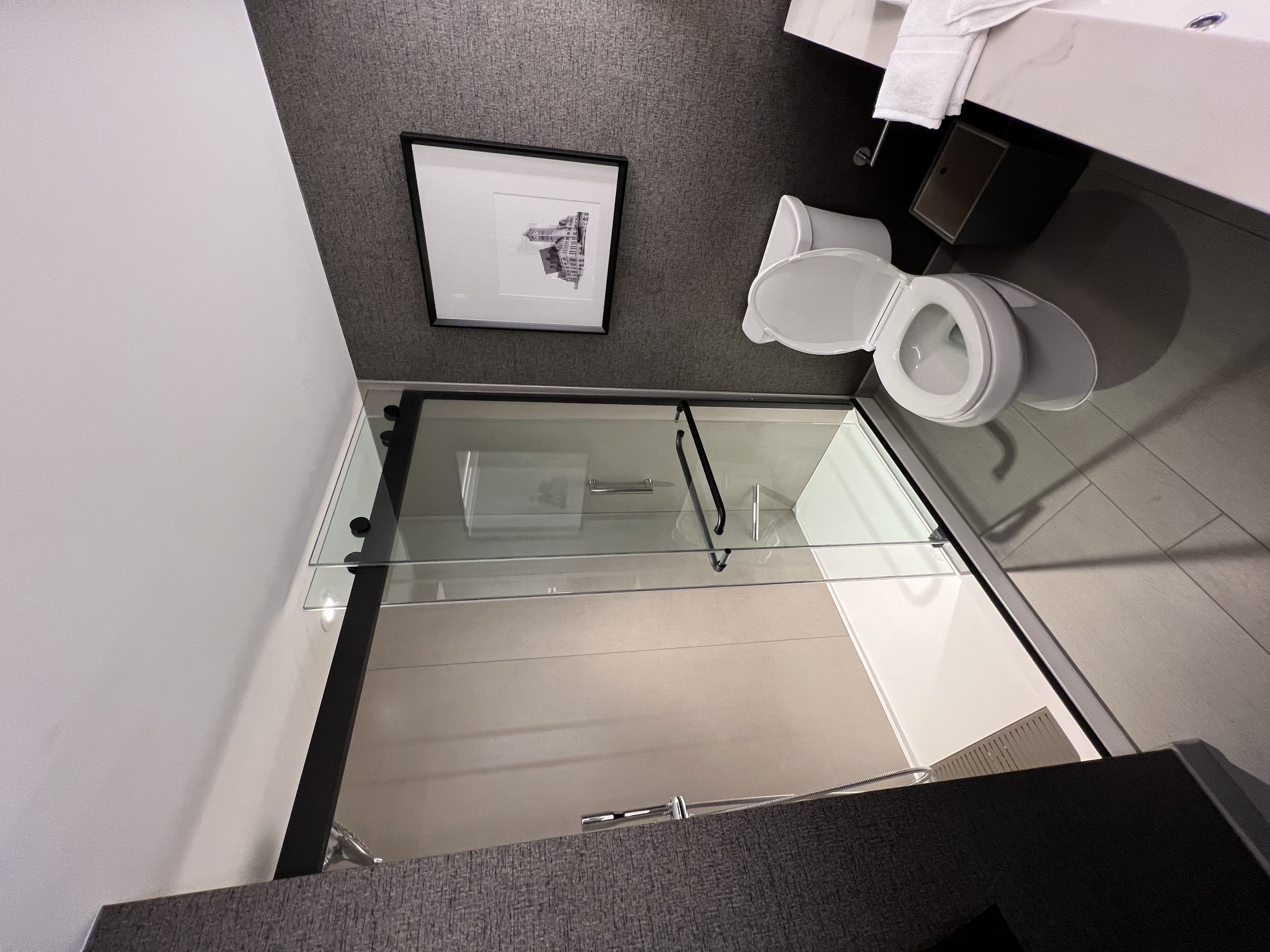 Bathroom electrical and lighting upgrade with glass shower enclosure